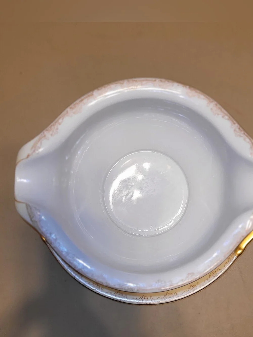 Mieto Porcelain Hand Painted Gravy Boat with Attached Saucer.